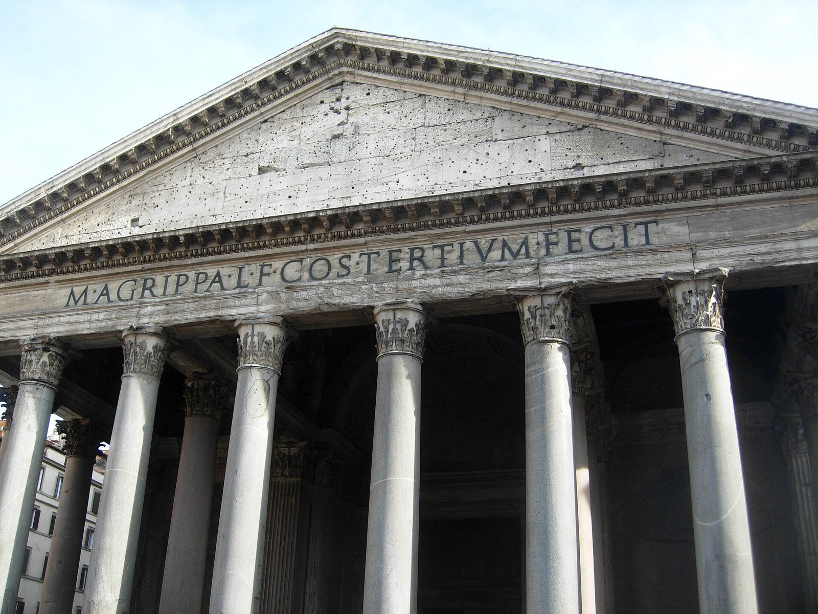 The portico of the Pantheon in Rome, its row of granite columns and triangular pediment seen from the square